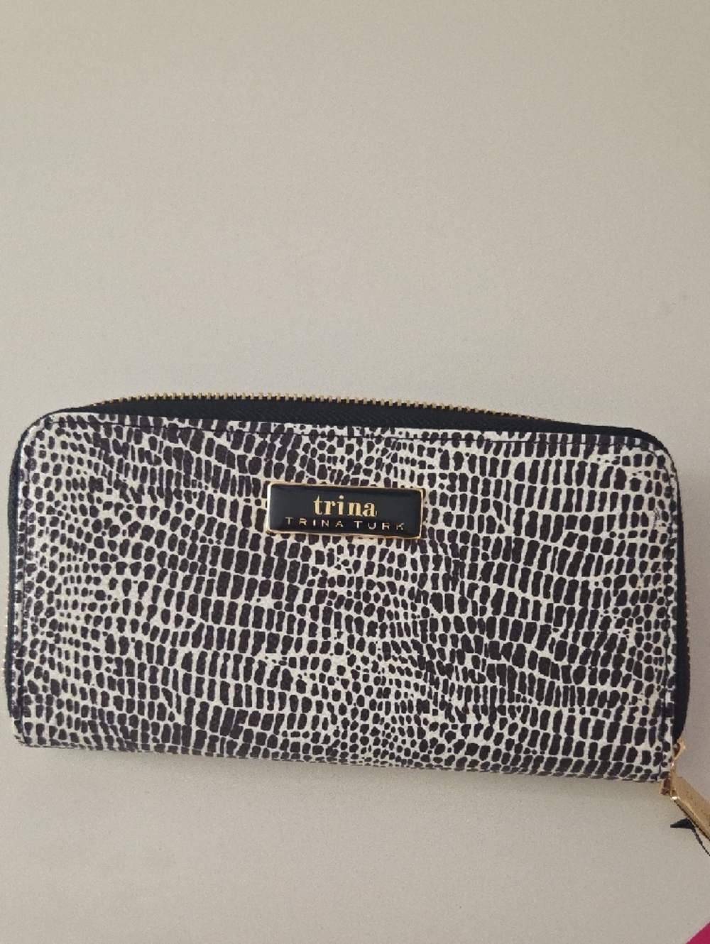 Trina Turk Large Zip Around Wallet in a black and white croco print design